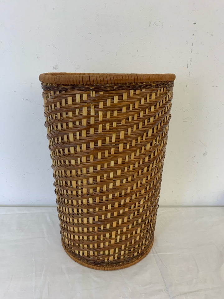 CARMEL COLORED WICKER TRASH BIN.