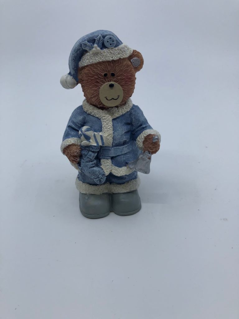 RESIN TEDDY BEAR IN BLUE COAT HOLDING SILVER BELL.