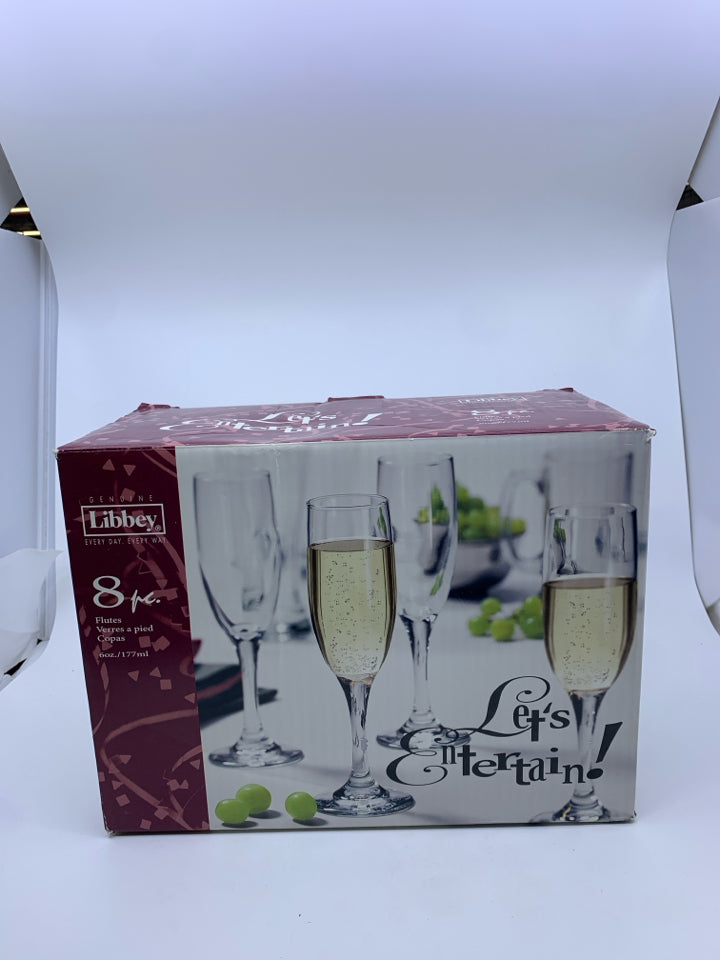 NIB LIBBEY 8 CHAMPAGNE FLUTES.