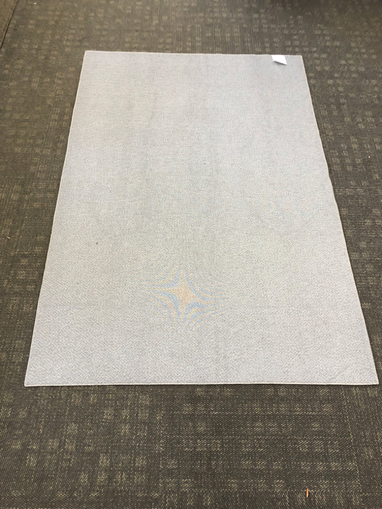 LIGHT GRAY RUG.