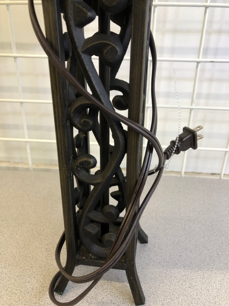 HEAVY METAL SCROLL BLACK BASE LAMP W CREAM SHADE.