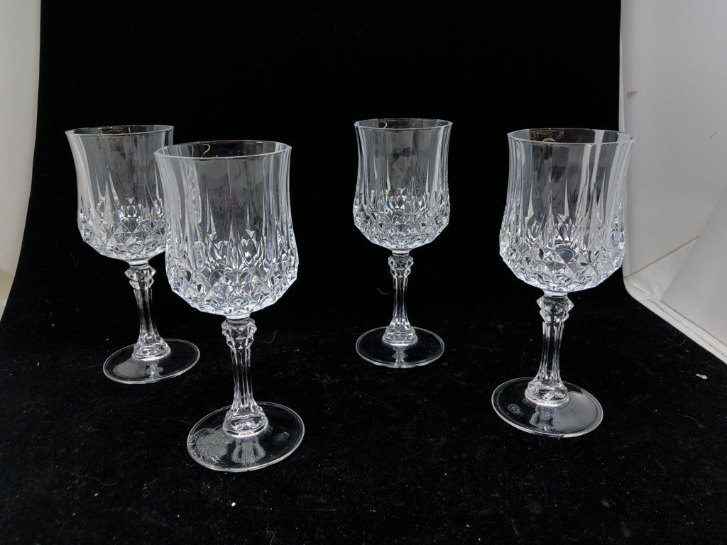 4 TALL CUT CRYSTAL WINE GLASSES.