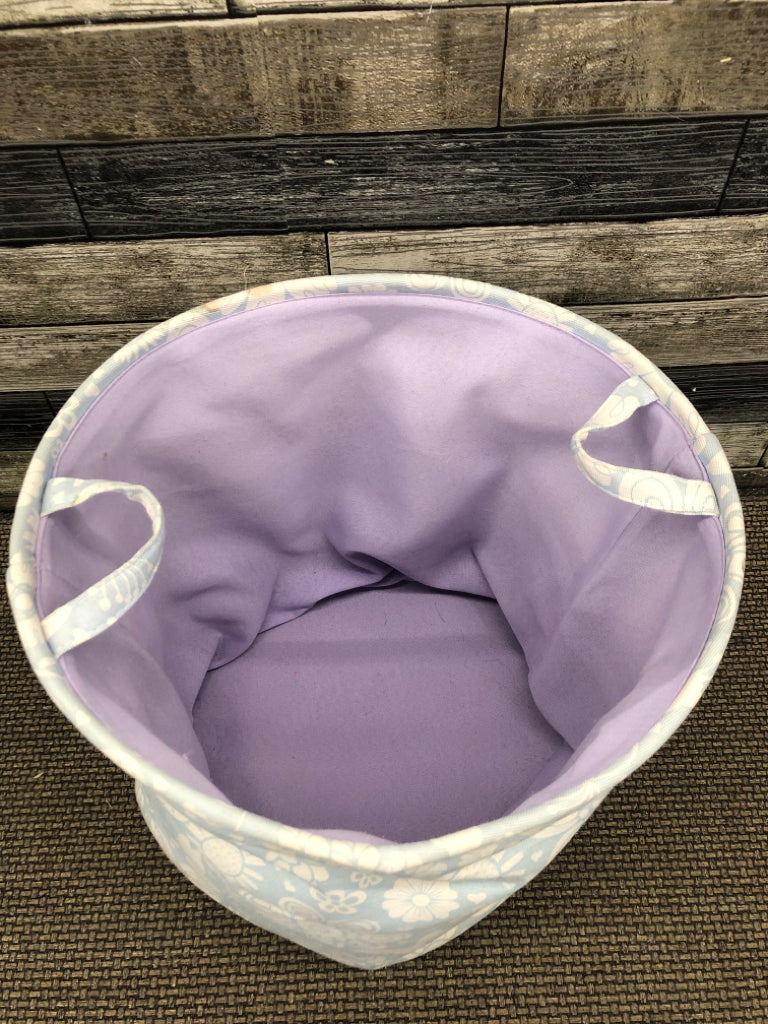 BLUE FLORAL CLOTH HAMPER.