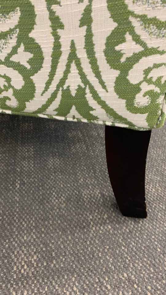 UPHOLSTERED GREEN PATTERNED ACCENT CHAIR.