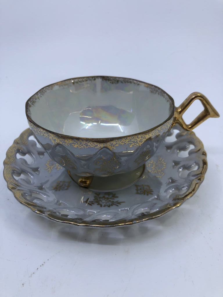 VTG LIGHT BLUE LACE PATTERN TEACUP AND SAUCER W GOLD ACCENTS.