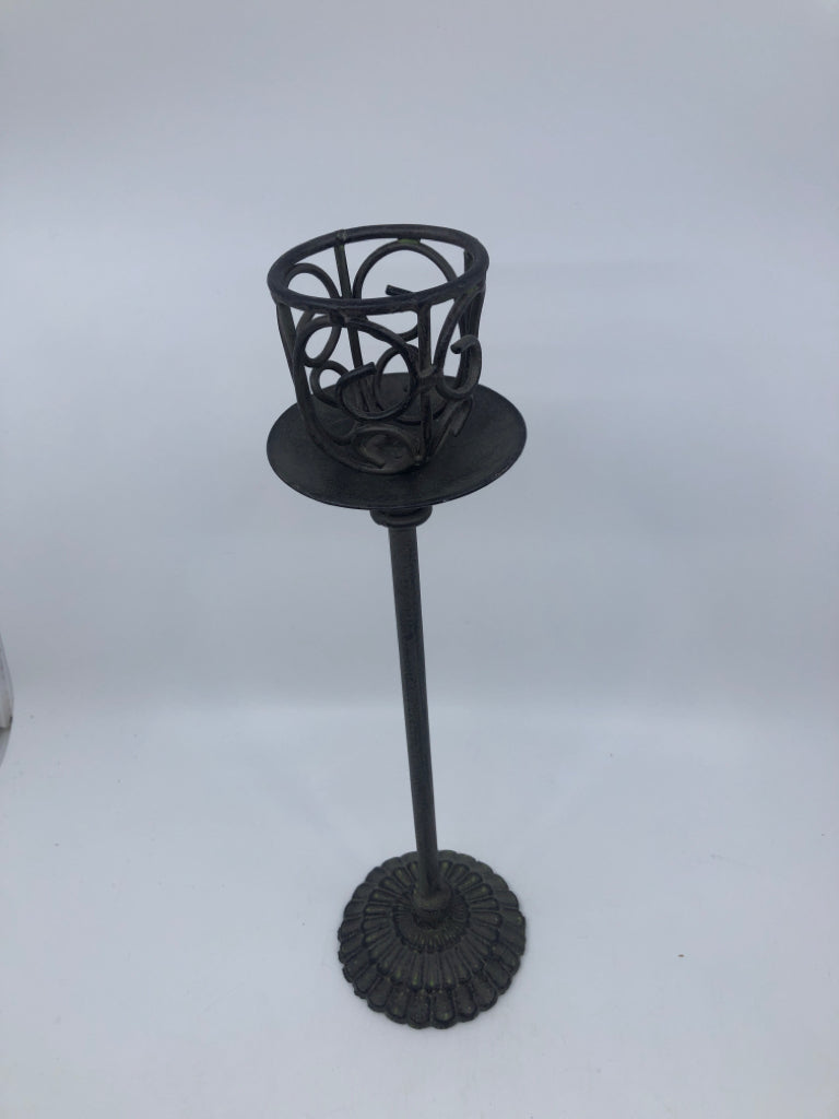 TALL GRAY METAL CUTOUT CANDLE HOLDER.