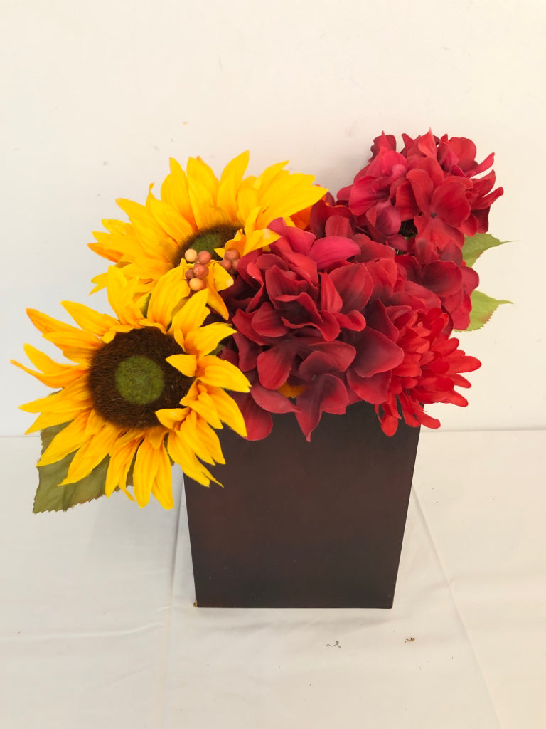 RED AND YELLOW FAUX FLORAL IN BROWN VASE.