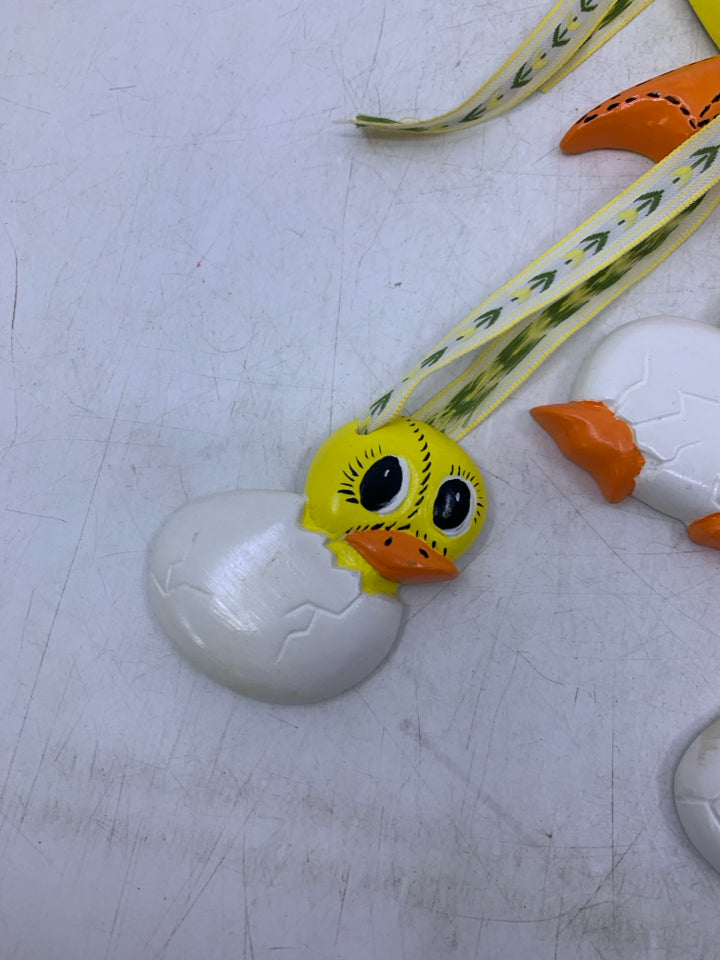 CERAMIC YELLOW DUCK W/ HANGING HATCHING DUCKLINGS.