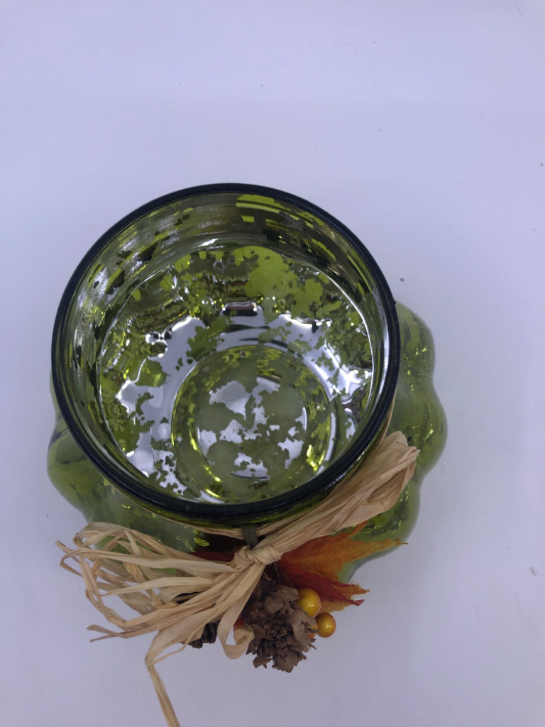 GREEN GLASS CANDLE HOLDER W/LEAVES AND BERRIES.