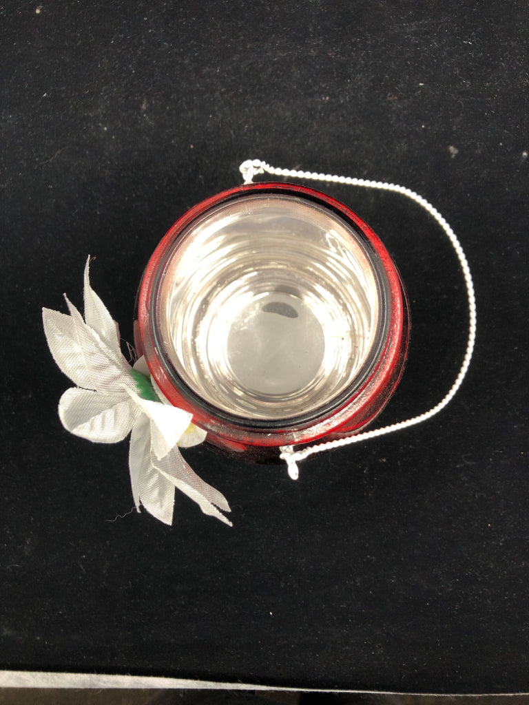 METALLIC RED MASON JAR WITH FLOWER.