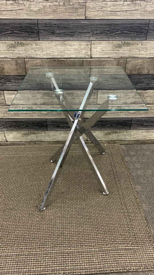GLASS TOP SILVER METAL BASE SIDE TABLE.
