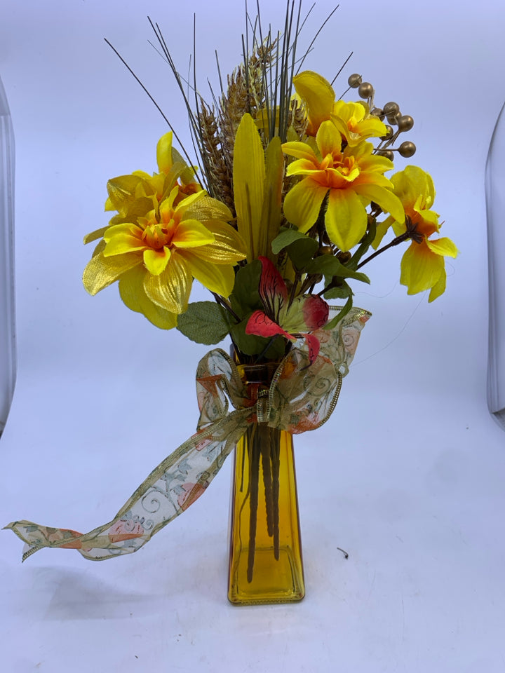 ORANGE VASE WITH FAUX SUNFLOWERS.
