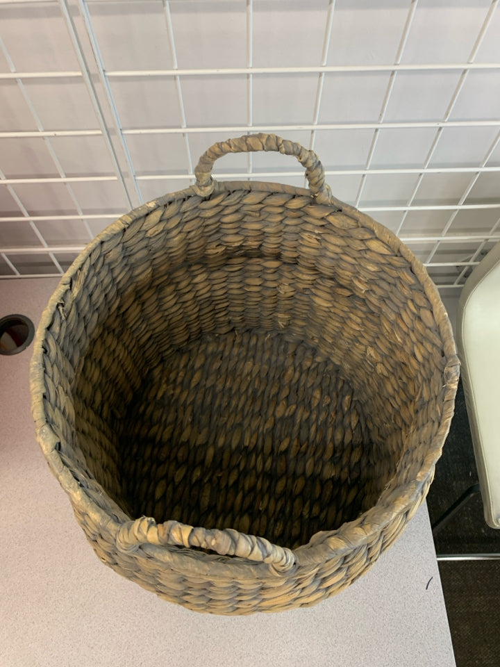 GRAY AND BEIGE WICKER BASKET.