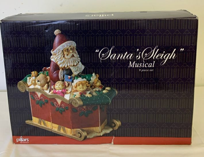 ENESCO PILLARS SANTA SLEIGH MUSICAL 9 PC SET.