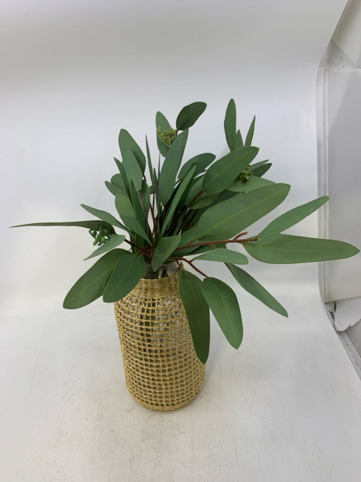 GLASS VASE W/ WOVEN WEAVE OVER IT FAUX LEAVES FILLER.