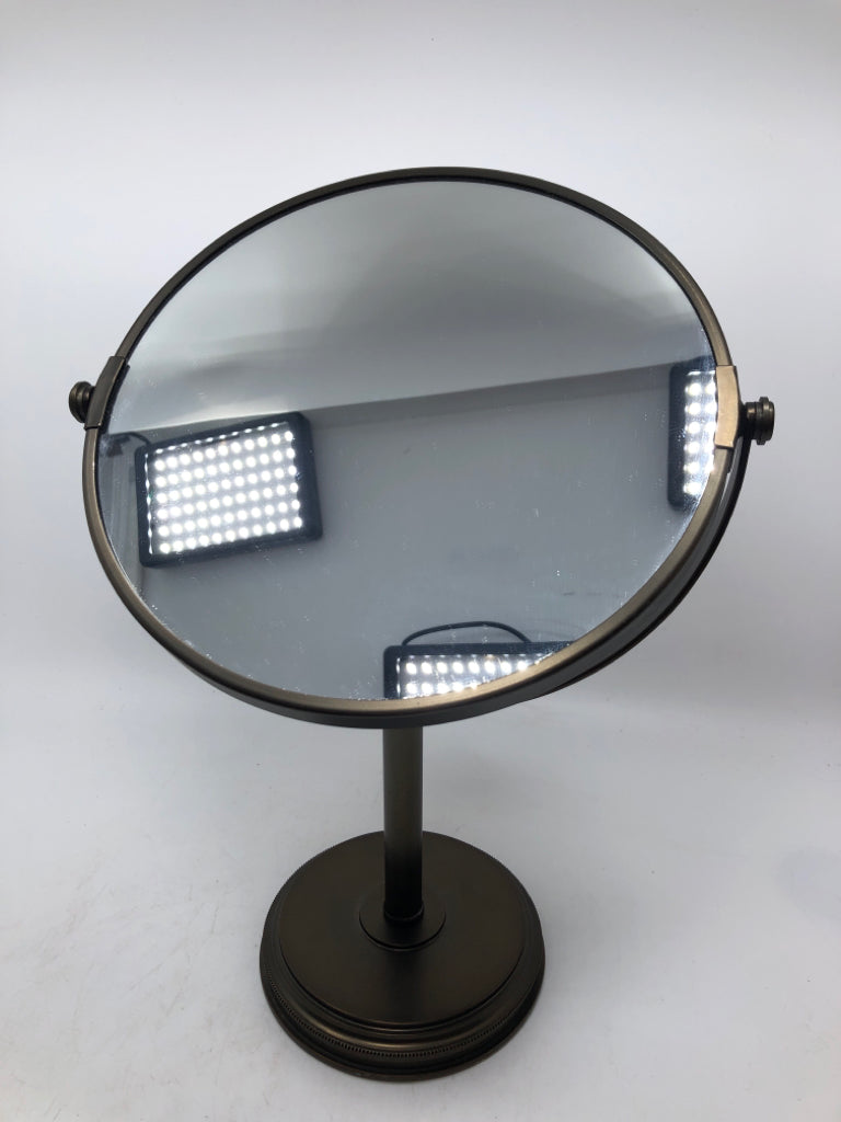 BRONZE COLORED FLIP-MIRROR.