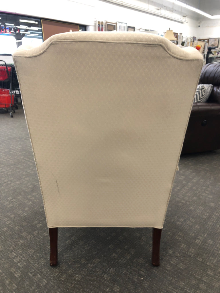 VTG CREAM WING-BACK CHAIR.