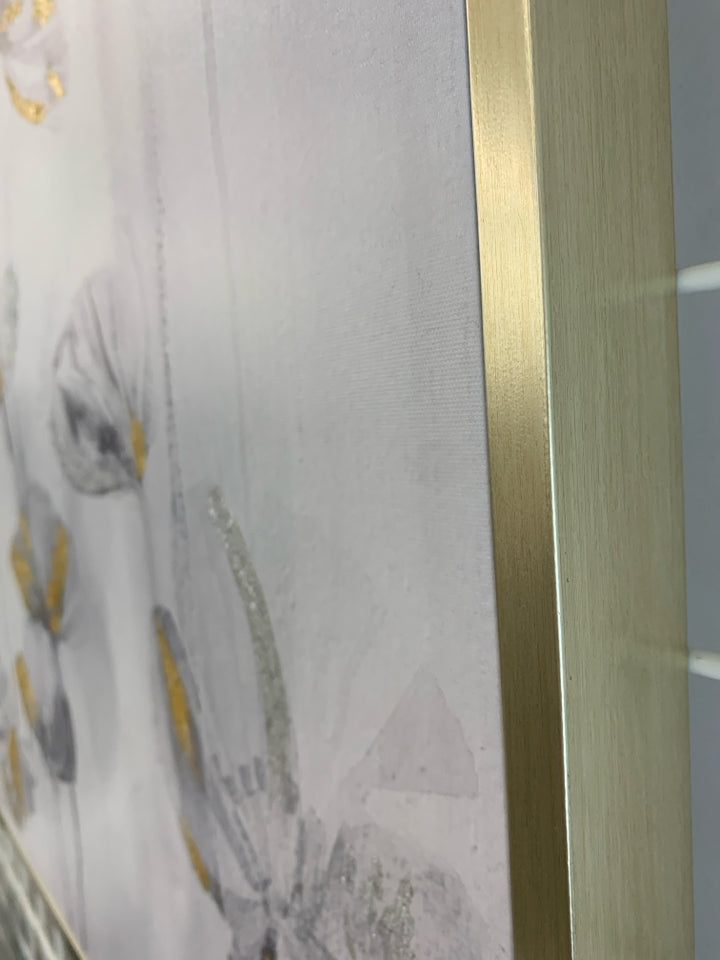 MANY B&W FLORALS ON FRAMED CANVAS W/GOLD DETAILS.