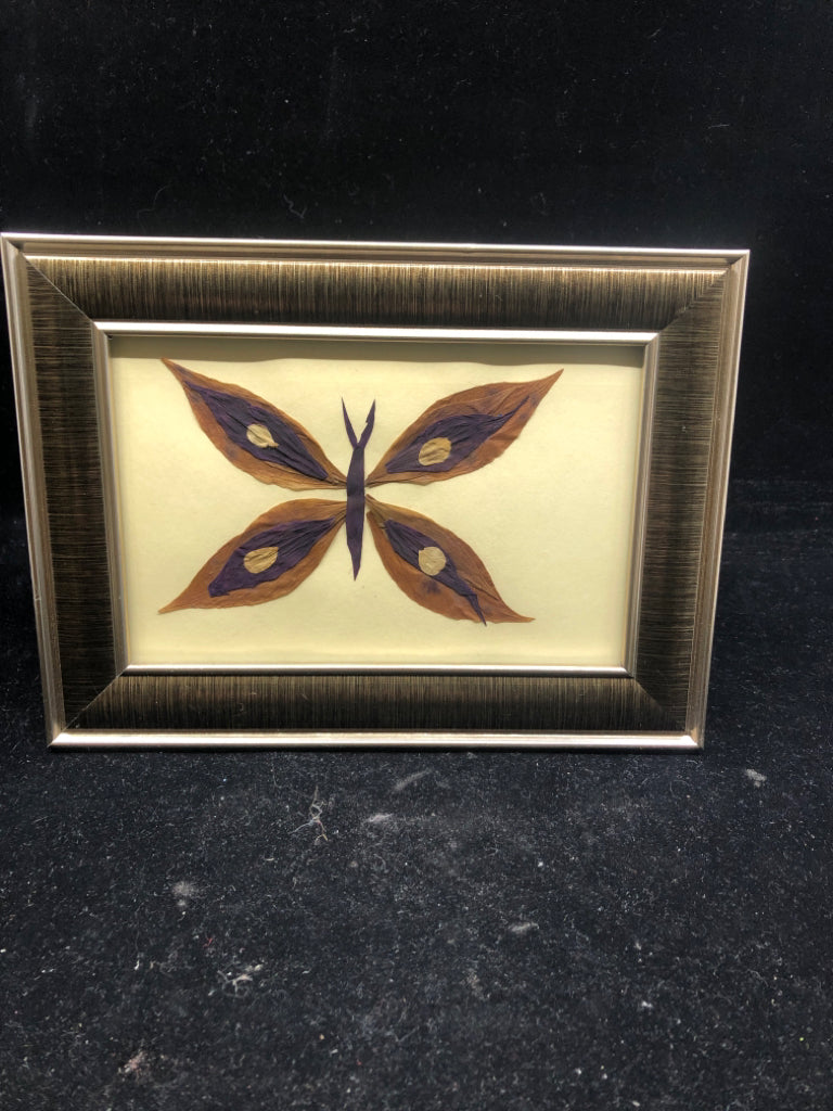 PURPLE FLORAL IN BROWN SLIVER FRAME.