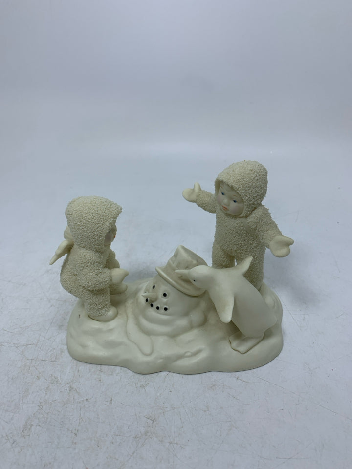 2 BABIES LOOKING AT MELTED SNOWMAN SNOWBABIES.