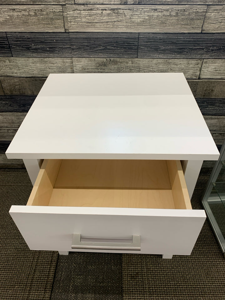 WHITE WOOD NIGHTSTAND W/DRAWER AND SHELF.