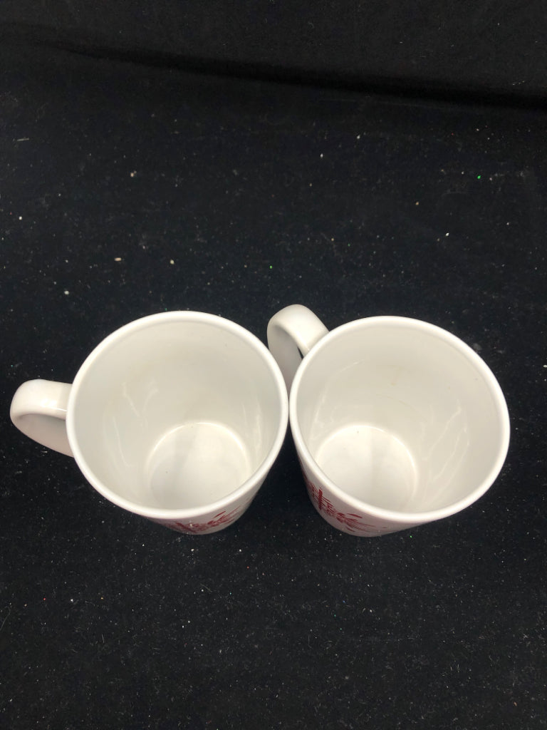 2 RED SNOWFLAKE MUGS.