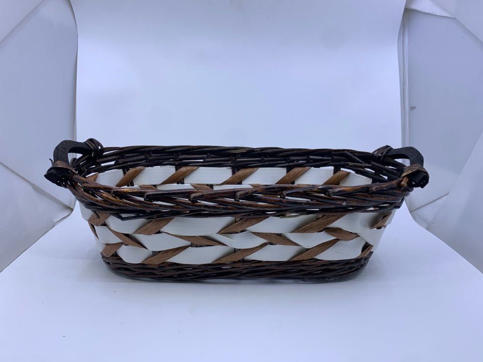 DARK WOVEN W WHITE ACCENTS OVAL BASKET.