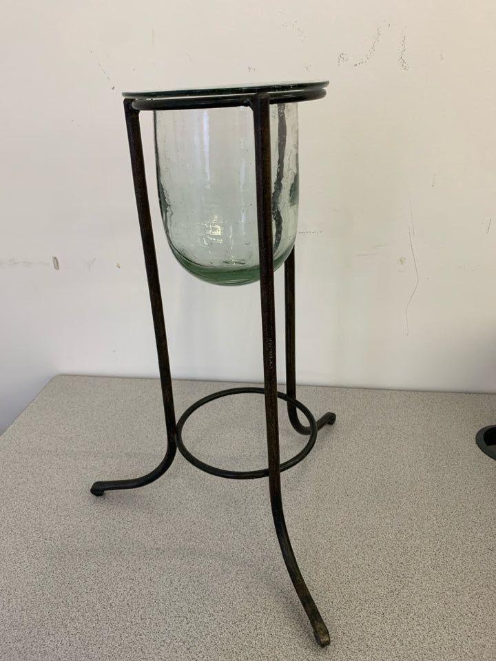 METAL STAND W/ GLASS CANDLE HOLDER CENTER.