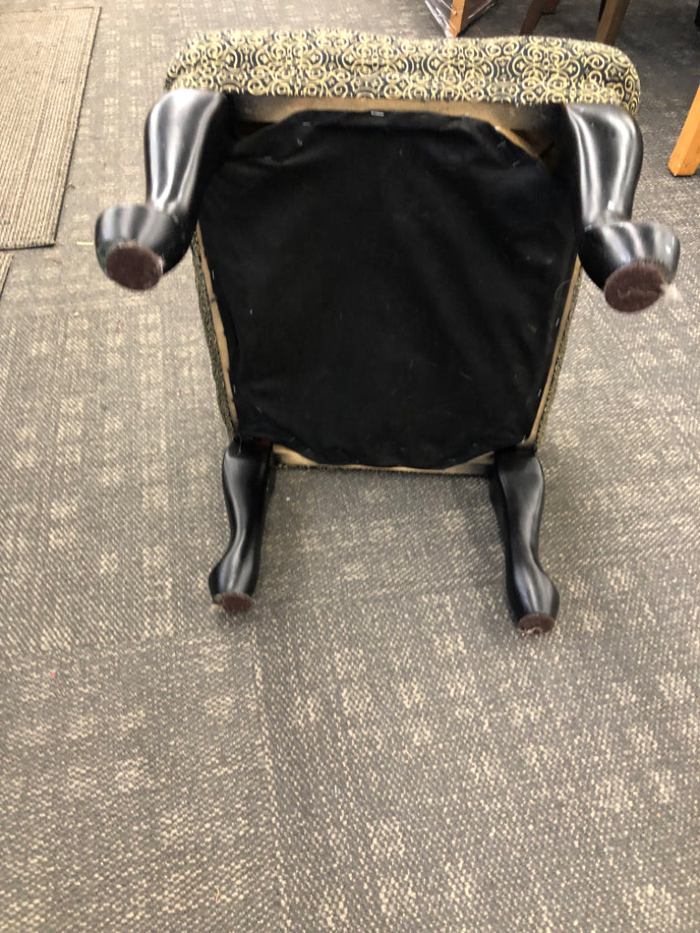 BLACK AND GOLD SCROLL PATTERN OTTOMAN.