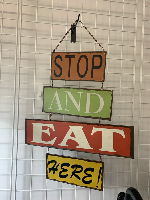 STOP AND EAT HERE METAL SIGN.