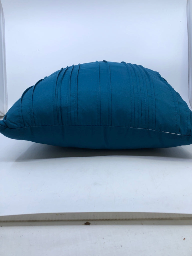 TEAL RUFFLED PILLOW.