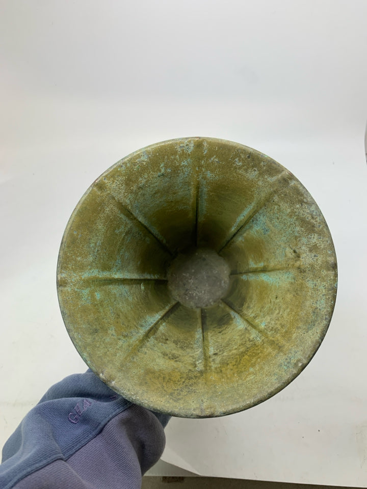 DISTRESSED FOOTED GREEN METAL VASE.
