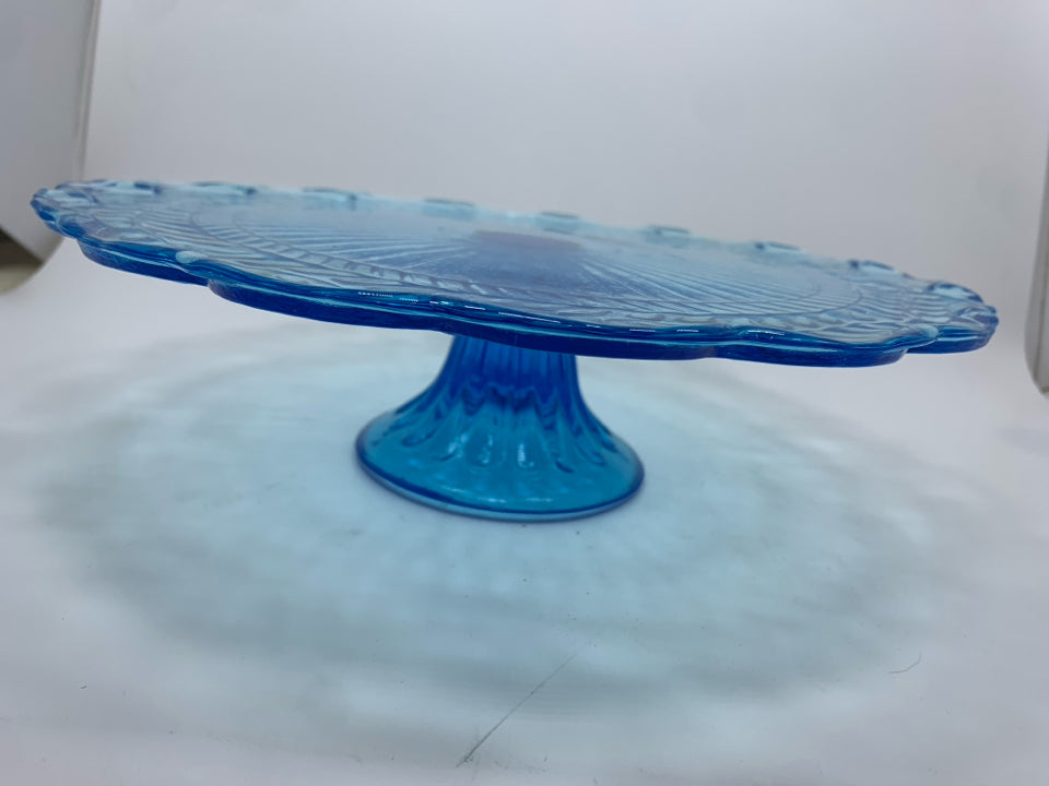 BLUE GLASS CAKE PLATE W/EMBOSSED LEAVES AND RUFFLE EDGE.