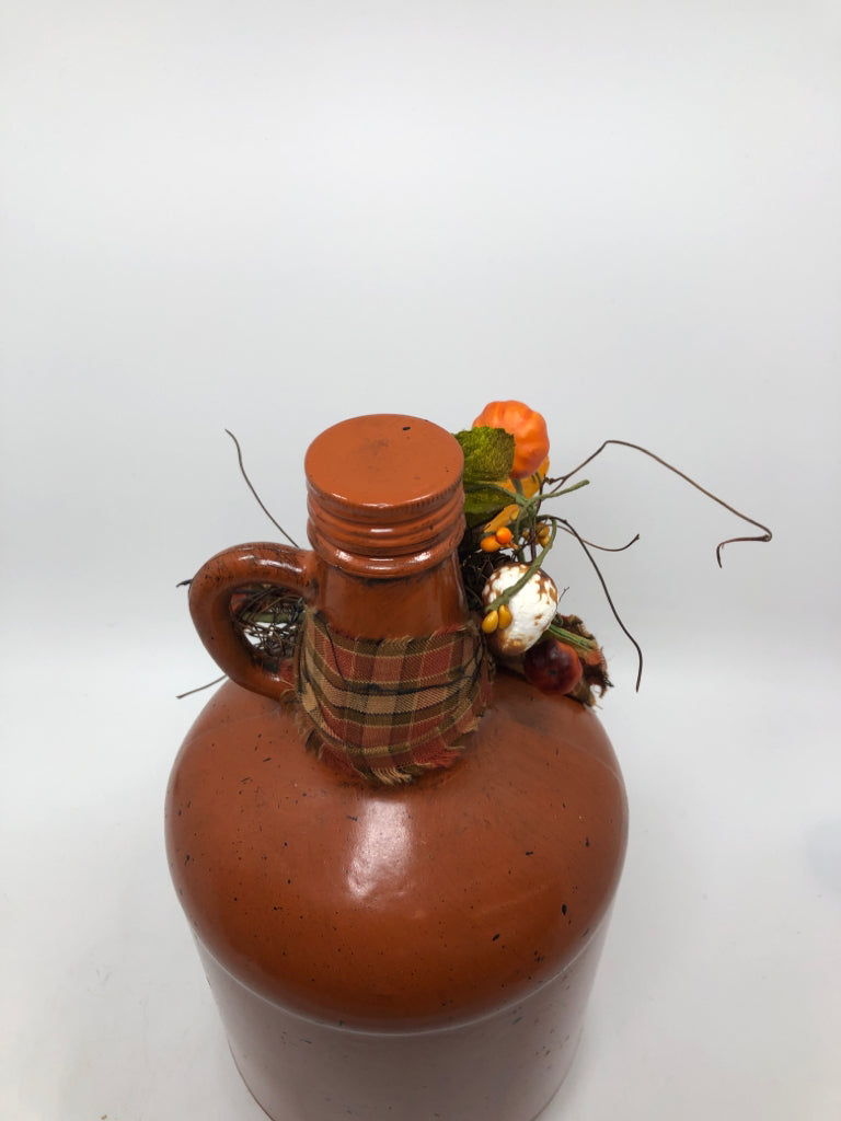 PRIMITIVE BROWN PAINTED GLASS JUG W/STAR AND PLAID BOW.