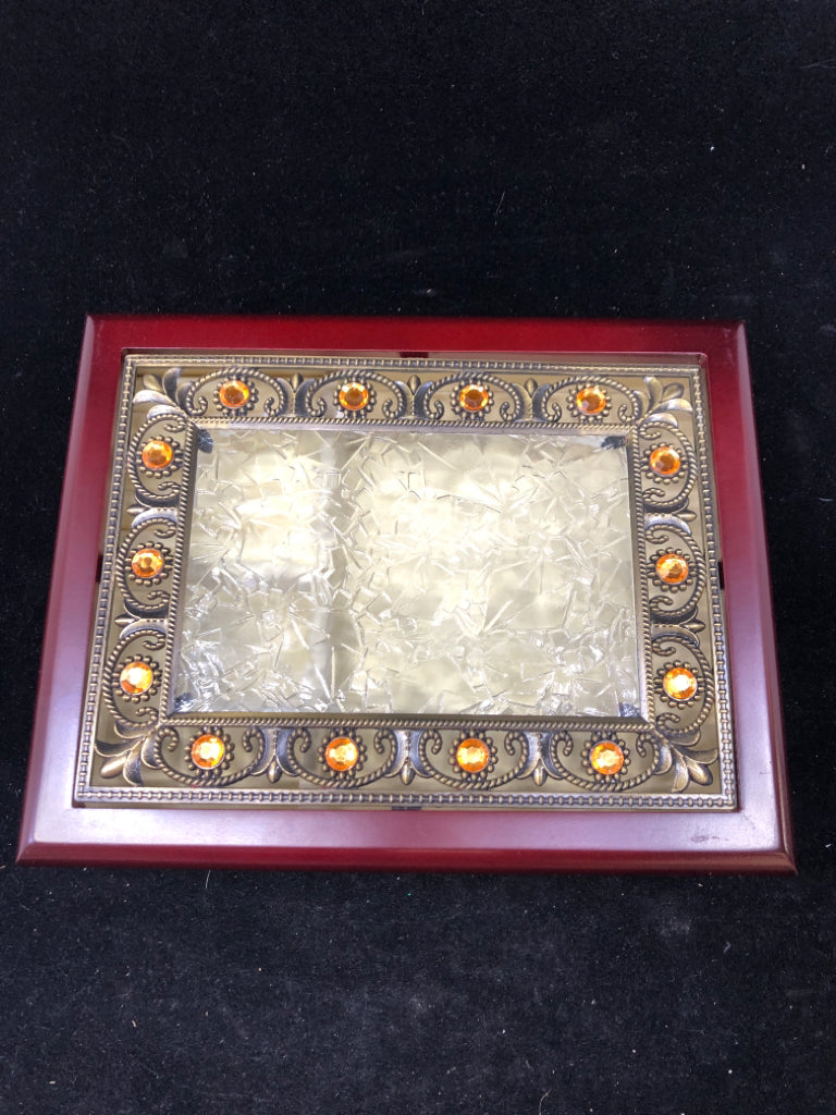 CHERRY COLORED WOOD W/ GLASS TOP METAL SCROLL DETAIL CREAM INTERIOR.