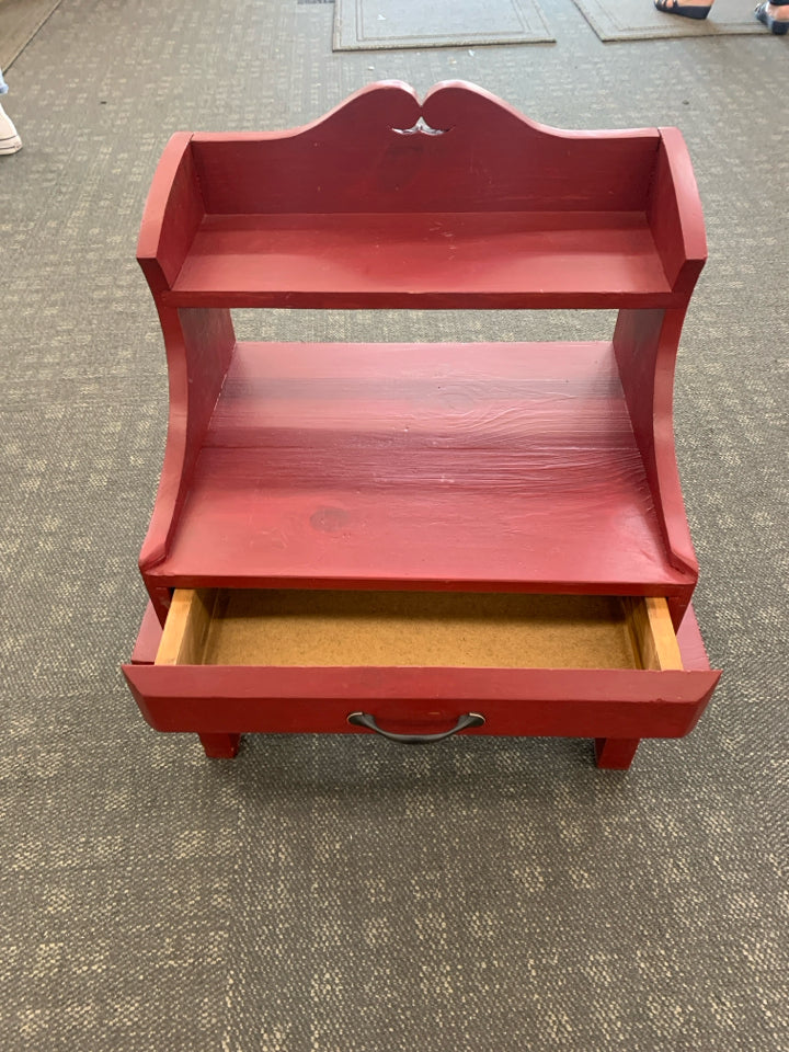 RED PAINTED WOOD TABLE WITH SHELF AND DRAWER.