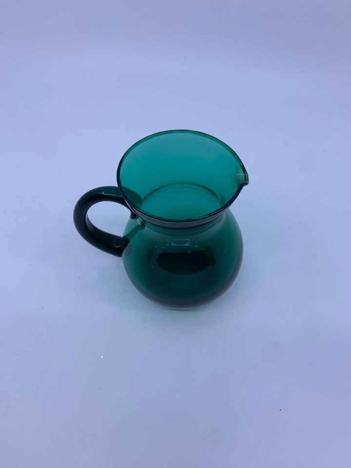 SMALL LIGHT GREEN GLASS PITCHER.