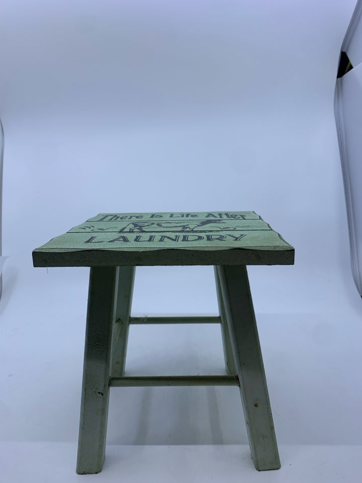 SMALL GREEN DECORATIVE STOOL.