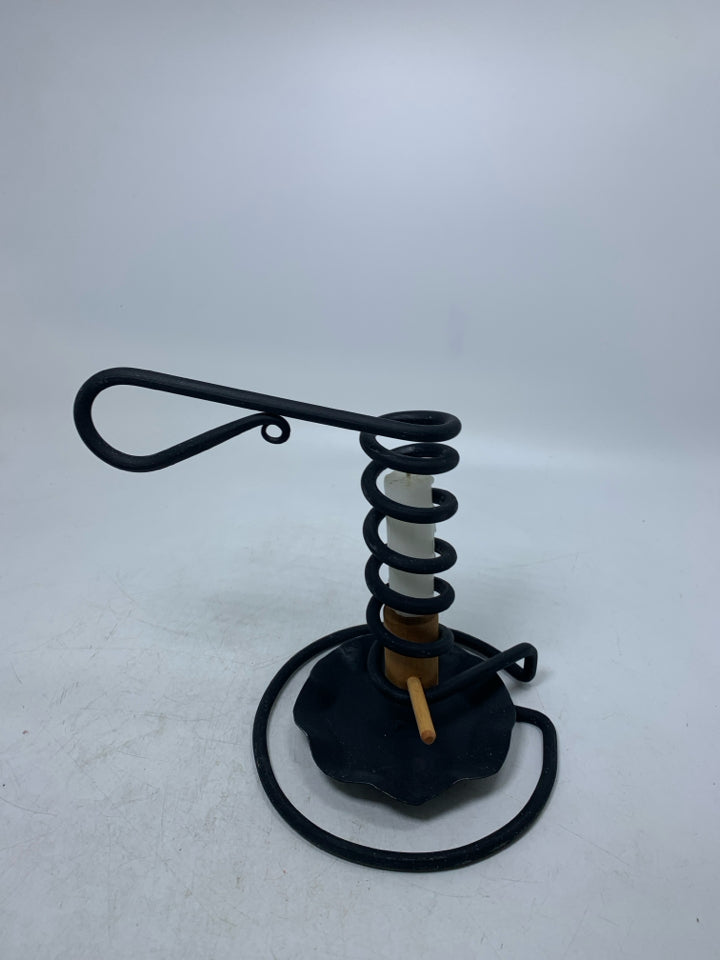 BLACK METAL COIL PRIMITIVE STYLE TAPERED CANDLE HOLDER.