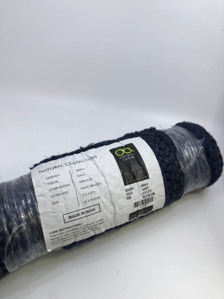 NIP NAVY BLUE RUG.