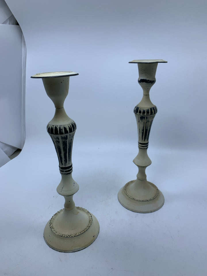 2 IVORY PAINTED METAL TAPER CANDLESTICKS.