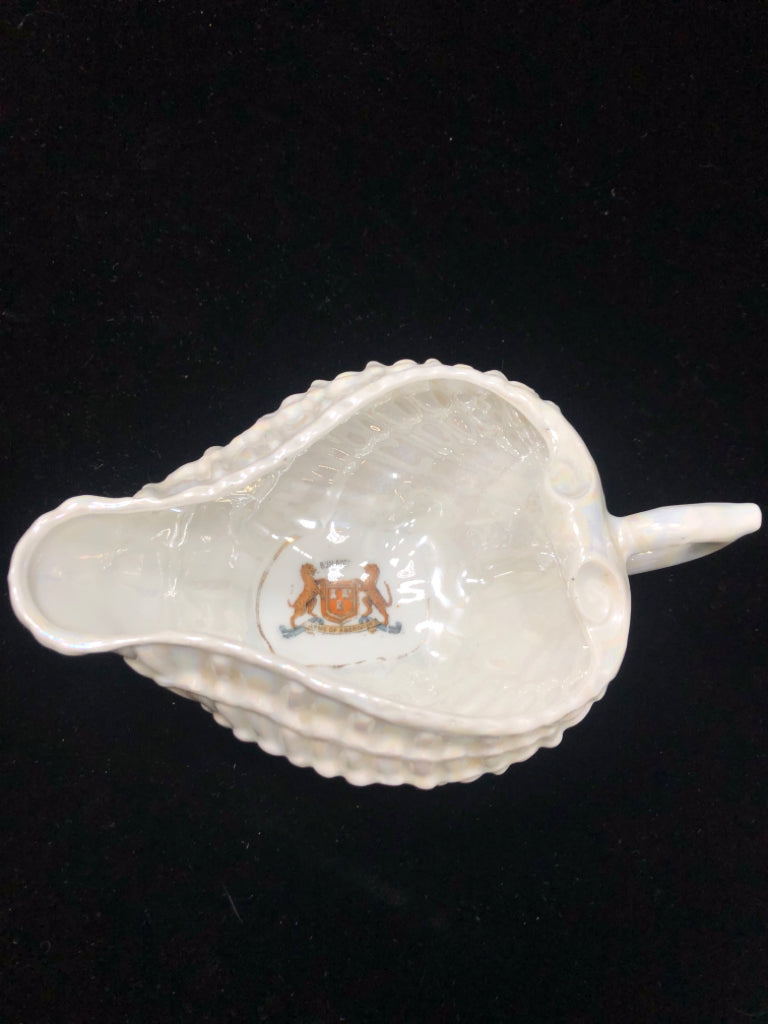 PEARLESCENT FOOTED SEASHELL DISH W/HANDLE.