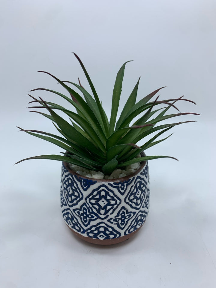 FAUX SUCCULENT IN BLUE AND WHITE CERAMIC POT.