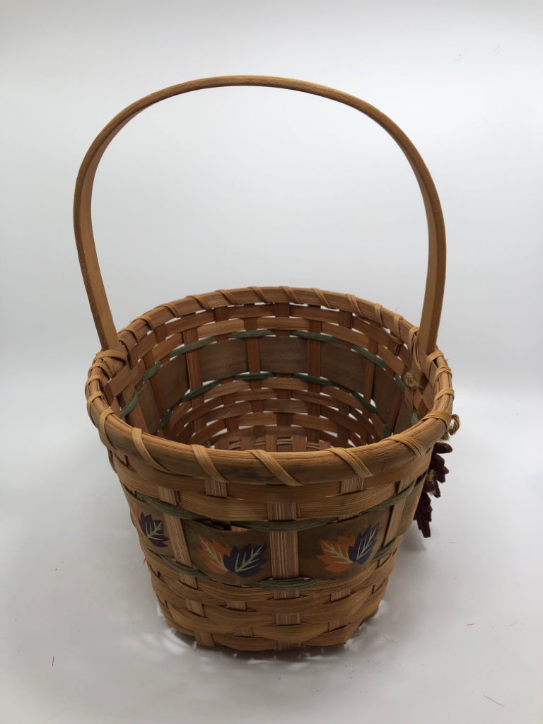 WOVEN BASKET W/WOOD LEAVES AND HANDLE.