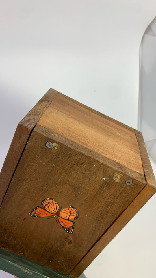 WOOD BIRDHOUSE W/BUTTERFLY DETAILS.
