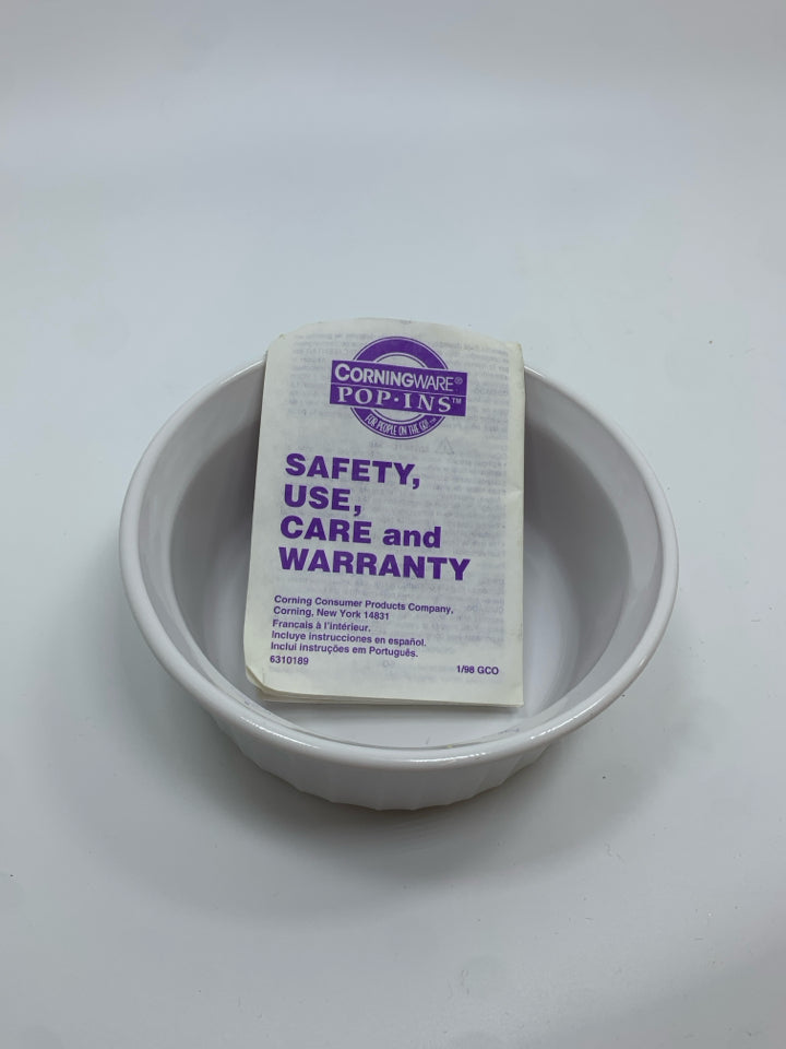 COVERED CORNING WARE DISH.