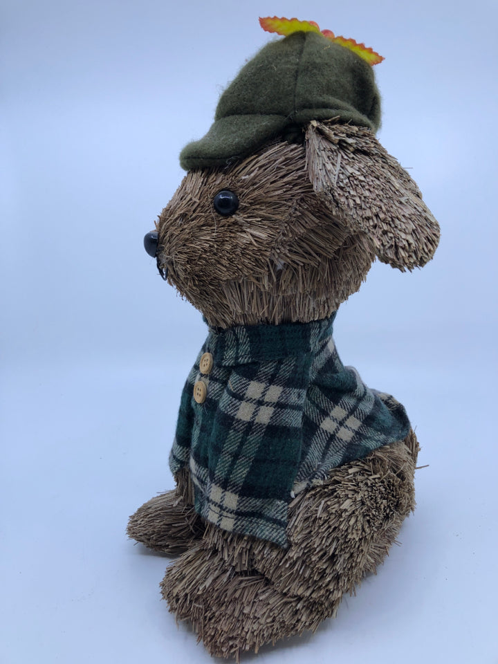 SMALL STRAW DOG IN HAT AND PLAID COAT.