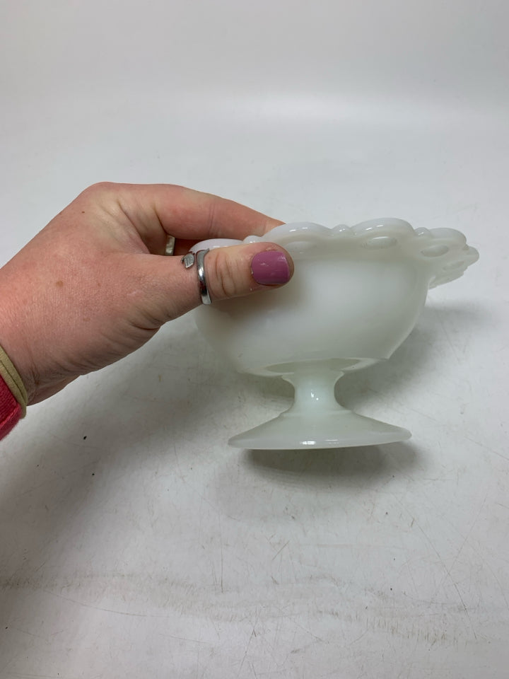 FOOTED MILK GLASS CANDY DISH W/ PIERCED EDGE.
