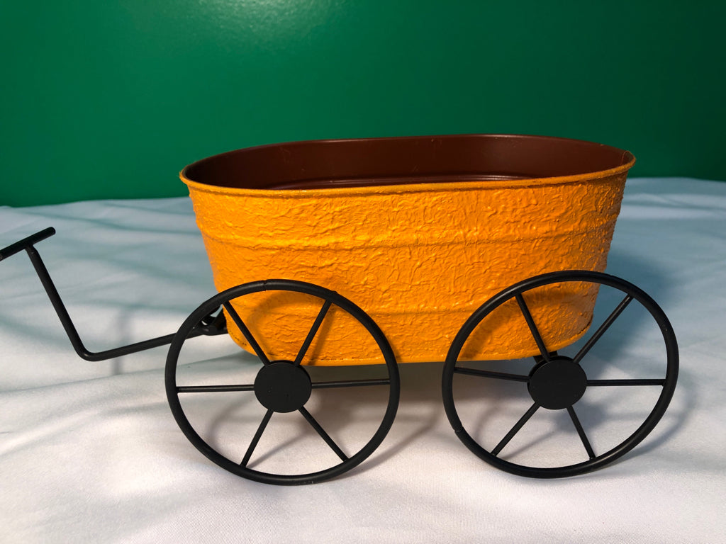 BLACK AND ORANGE OVAL WAGON.