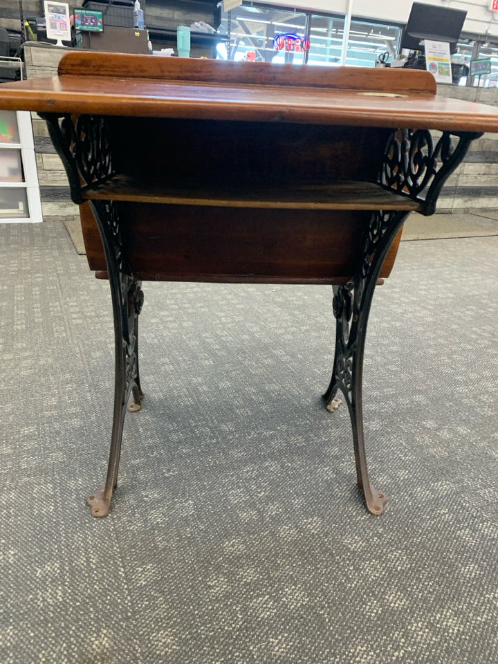 VTG DK WOOD SCHOOL DESK W/IRON SCROLL BASE.